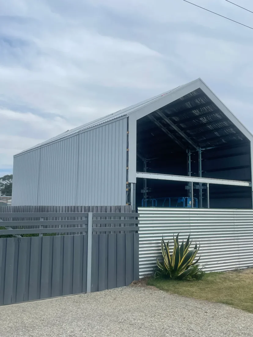 The clad gable end of Shed Home #03 with the main opening still open