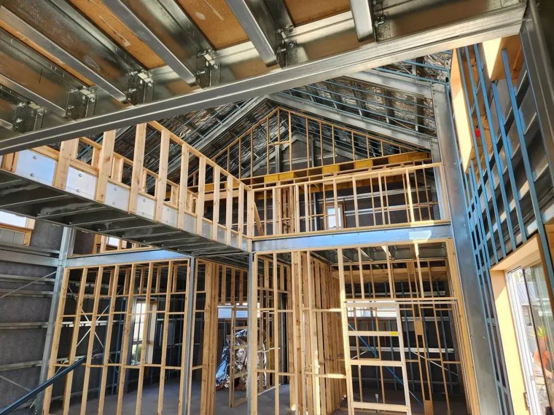 Internal partition framing standing inside the completed steel shell