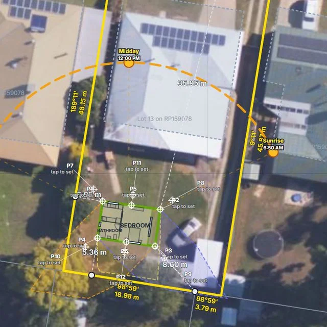 The Shouse Designer siting view: a one-bedroom Pod plan drawn inside a yellow parcel boundary over aerial imagery, with the bearings of each boundary and level points marked